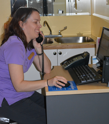 A team member on the phone with a client